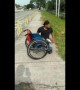 Heartwarming moment disabled man climbs out of wheelchair to save kitten stuck in drain in Malaysia