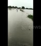 Brave boy guides ambulance by running though flood waters