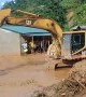 Excavator used to transport people trapped by flooding in Vietnam