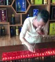 Kung fu master blows out 120 candles using EARS