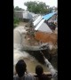Shops on river edge collapse and get washed away in central Indian floods