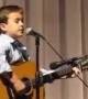 Boy Masters Guitar During Johnny Cash Cover Performance
