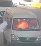 Minibus driver escapes through window after vehicle catches fire at petrol station in China