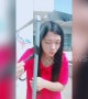 Chinese girl uses a hot outdoor water pipe to curl her hair