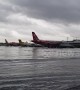 Planes stranded in knee-deep water after Tropical Storm Bailu floods airport