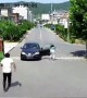 Heroic man manages to stop driverless car from rolling down road in China