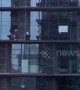 Heroic policemen rescue distressed woman from window ledge