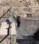 Nerve-wracking moment UK couple cross windy bridge in Nepal