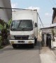 Bread truck fails to clear telephone lines and blocks traffic in Indonesia