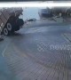 Shocking moment dump truck in India topples over into ocean