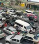 Cars cover zebra crossing during rush hour traffic in Bangkok
