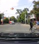 Cyclists Struggle at Stop Sign