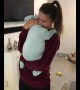 She appears to be holding a baby, but just wait for it!