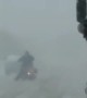 Firetruck Escorts Motorcycle Through the Snow