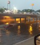 Car Takes on Flooded Underpass in Reverse