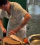 Man Prepares Milkfish in Philippine Market