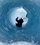 Sliding Through Glacial Ice Cave