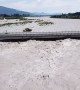Flooded River Rises To Bridge's Roadway