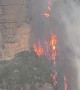 Fire in Australia filmed hugging cliffside like 'lava waterfall'