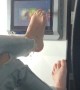Disgusting passenger uses foot to swipe touch screen during flight