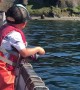 Excited Three-Year-Old Catches a Fish