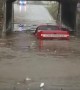Truck Tries to Cross Flooded Underpass