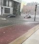 Man Uses Cup to Remove Water From His Waterlogged Car on Flooded Street