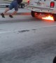 Person Gives Burning SUV a Push