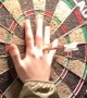 Woman Throws a Perfect Bullseye in Darts Game