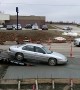 Sedan Gets Sunk in Wet Cement