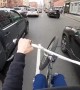 Cyclist Skillfully Weaves His Way through Traffic