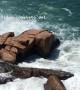 Man Hides Behind Rocks as Waves Come