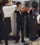 Talented Young Orchestra Playing in Lobby