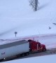 Police Car Pulls Truck Along Icy Road
