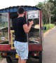 Tuktuk Tows Skateboarder