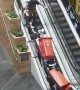 Man Makes a Huge Paper Mess Going Up Escalator