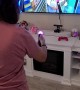 Woman Struggles Playing VR Game