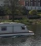 A Cool Caravan Boat Floating the River