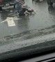 Brawl in the Rain at an Intersection