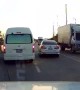Van Dodging a Turning Car Clips Motorcyclist