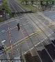Shocking moment man nearly gets hit by speeding train after lifting barrier
