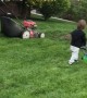 Toddler Follows Dad's Lead in Mowing the Lawn