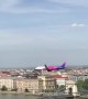 Commercial Plane Flying Low Over Danube River