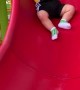 Baby Slips Slowly Down Slide