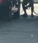 Guy Using Gas at Gas Pump to Clean Car