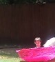 Boxer Pup Plays With Kid in Pool