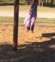 Large Group of Kids Spinning around on Playground Equipment