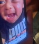 Baby in shock as he watches a video of himself crying