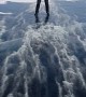 Strong Winds Slides Man Across Frozen Lake
