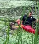 Quick-thinking police officer uses kayak to save dog from drowning in muddy pond